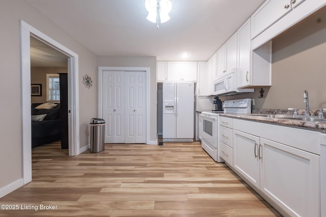 432 Four Seasons Rd, Falls Of Rough, KY 40119 - kitchen with white appliances, a sink, light wood finished floors, and white cabinets