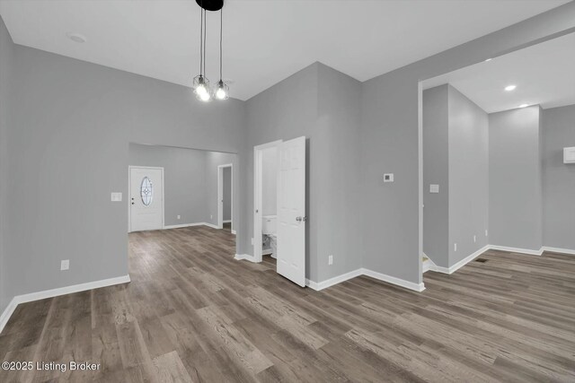 2203 Date St, Louisville, KY 40210 - spare room with baseboards and wood finished floors