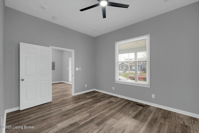 2203 Date St, Louisville, KY 40210 - empty room with baseboards, dark wood-style floors, electric panel, and a ceiling fan