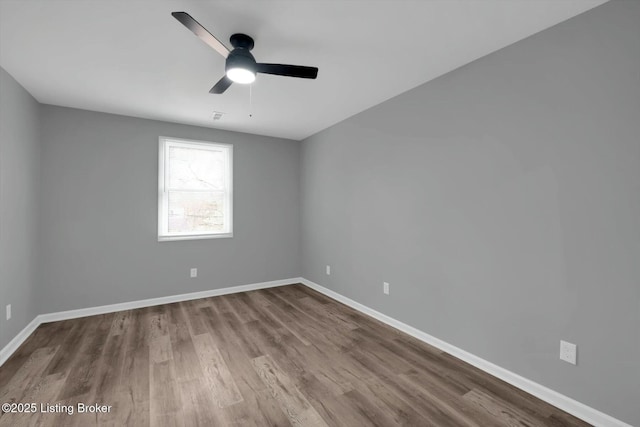 2203 Date St, Louisville, KY 40210 - empty room featuring baseboards, ceiling fan, and dark wood-type flooring