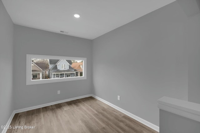 2203 Date St, Louisville, KY 40210 - unfurnished room featuring recessed lighting, visible vents, baseboards, and wood finished floors