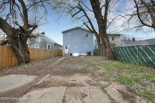 2203 Date St, Louisville, KY 40210 - back of house with cooling unit and a fenced backyard