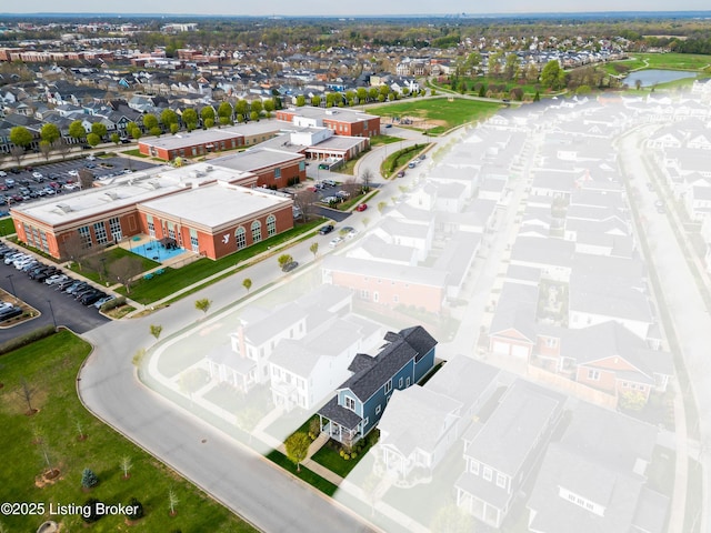 bird's eye view with a residential view and a water view