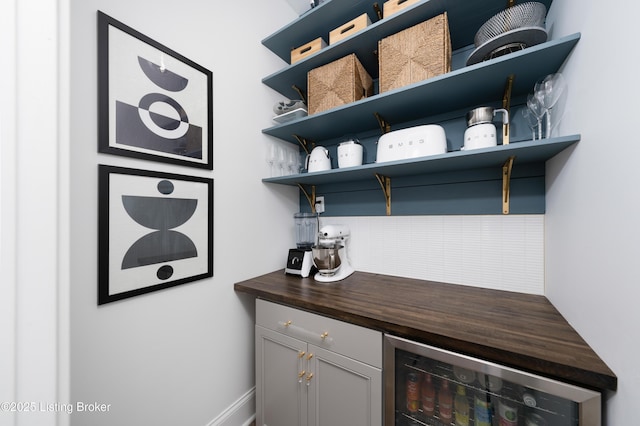 bar with beverage cooler and a dry bar