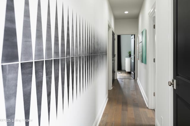 hallway featuring recessed lighting, baseboards, and wood finished floors