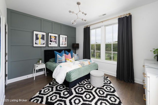 bedroom featuring dark wood-type flooring, visible vents, and baseboards