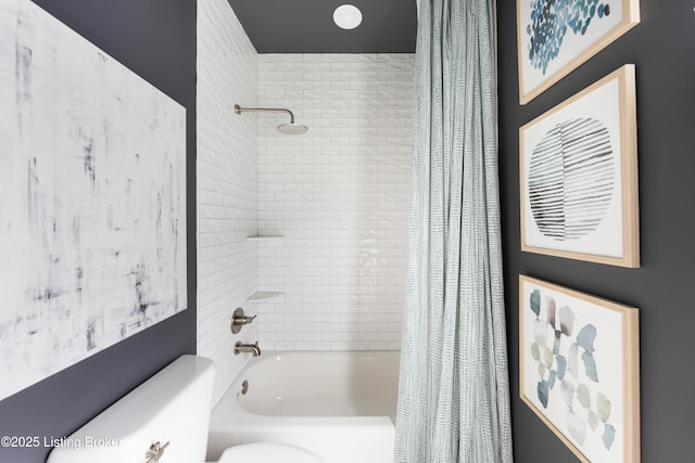 full bathroom with shower / tub combo and toilet