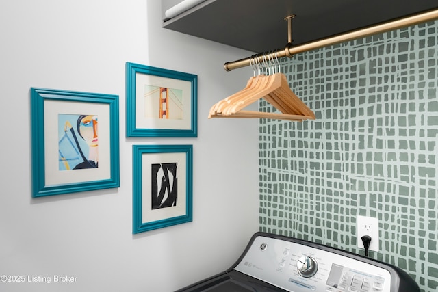 clothes washing area featuring washer / clothes dryer