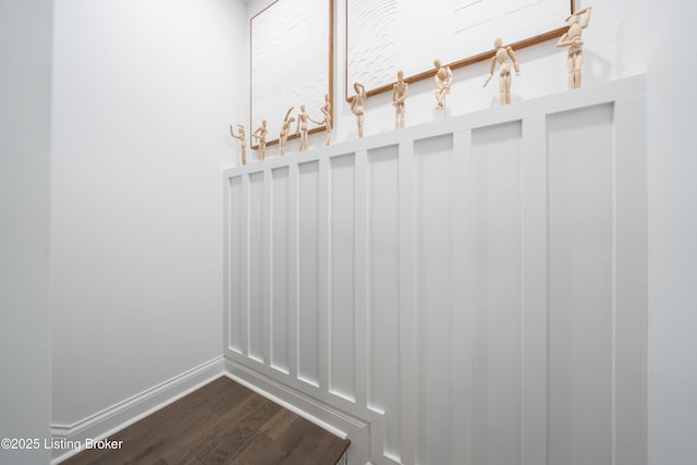 mudroom with baseboards and dark wood finished floors