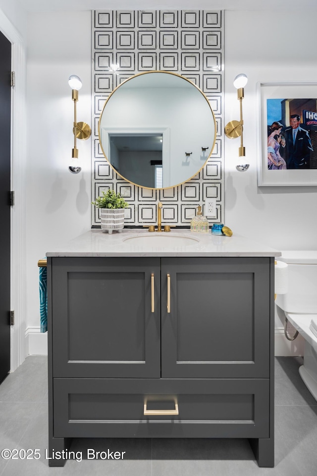 bathroom with tile patterned floors and vanity