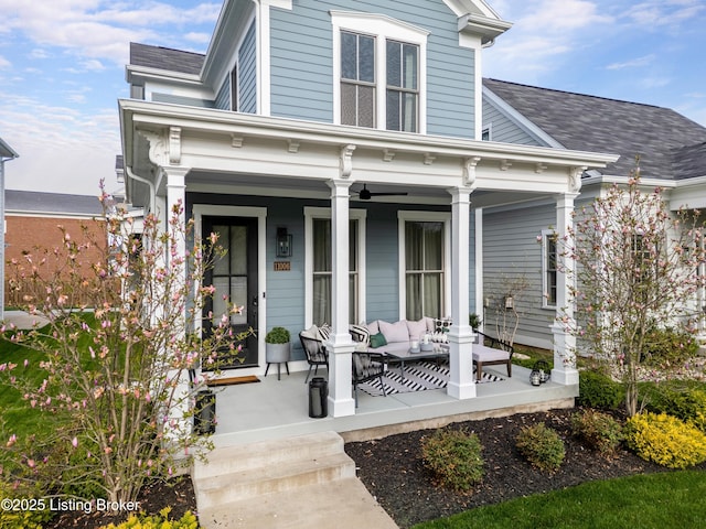 exterior space featuring an outdoor living space, covered porch, and roof with shingles