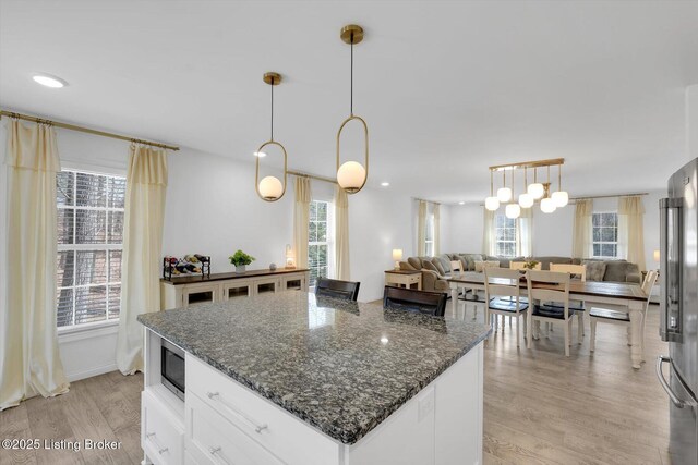 100 Bellemeade St, Brandenburg, KY 40108 - kitchen featuring open floor plan, light wood-style flooring, and stainless steel appliances
