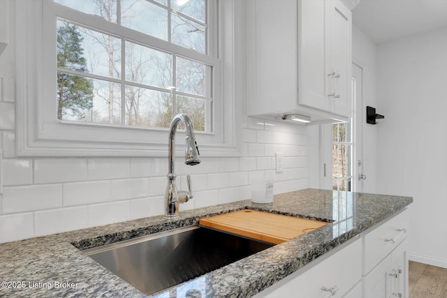 100 Bellemeade St, Brandenburg, KY 40108 - kitchen featuring a sink, white cabinetry, and dark stone counters