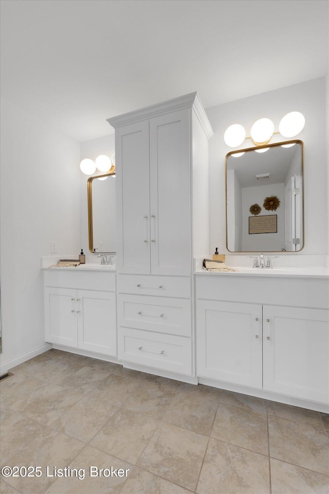 100 Bellemeade St, Brandenburg, KY 40108 - full bath featuring a sink, two vanities, and baseboards