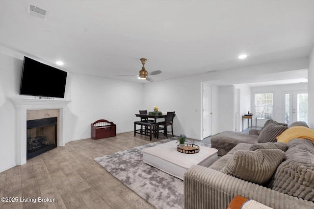 100 Bellemeade St, Brandenburg, KY 40108 - living area featuring visible vents, light wood-type flooring, a ceiling fan, recessed lighting, and a premium fireplace