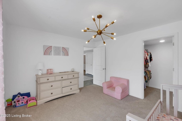 100 Bellemeade St, Brandenburg, KY 40108 - carpeted bedroom with a spacious closet and an inviting chandelier