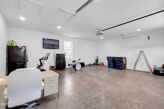 100 Bellemeade St, Brandenburg, KY 40108 - garage with recessed lighting, freestanding refrigerator, and a garage door opener