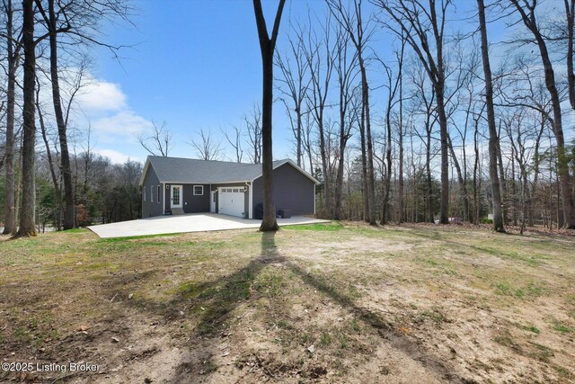 100 Bellemeade St, Brandenburg, KY 40108 - view of front of house with concrete driveway and an attached garage