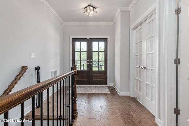 11125 Radleigh Ln, Louisville, KY 40291 - foyer with french doors, wood finished floors, ornamental molding, and baseboards