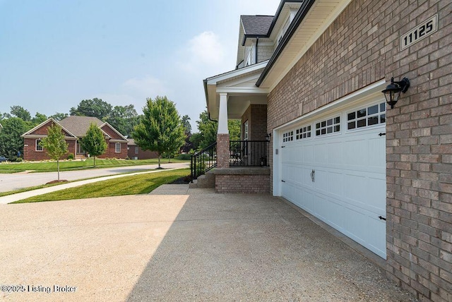 11125 Radleigh Ln, Louisville, KY 40291 - view of property exterior with asphalt driveway and brick siding