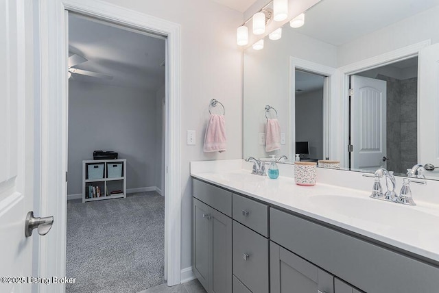 11125 Radleigh Ln, Louisville, KY 40291 - full bath with double vanity, ceiling fan, and baseboards