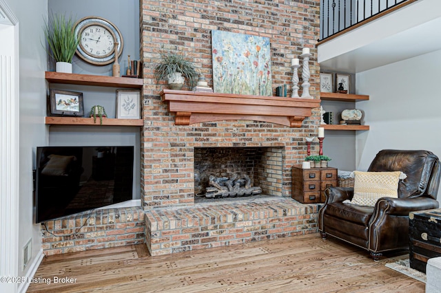1014 Old Mill Stream Ln, Shepherdsville, KY 40165 - living room featuring wood finished floors, a brick fireplace, and a towering ceiling