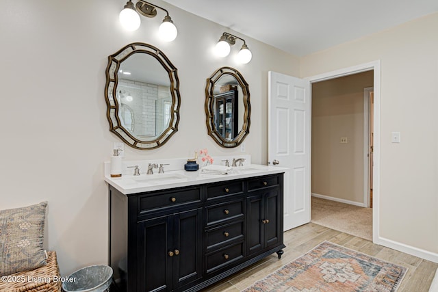 1014 Old Mill Stream Ln, Shepherdsville, KY 40165 - full bath featuring double vanity, wood finished floors, and baseboards