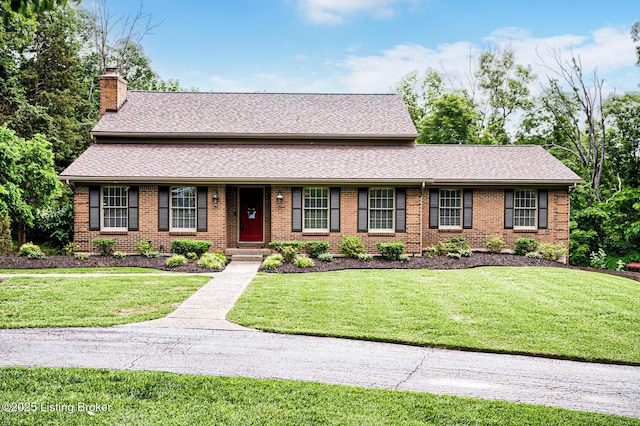 1014 Old Mill Stream Ln, Shepherdsville, KY 40165 - view of front of home featuring a chimney, brick siding, a front yard, and roof with shingles