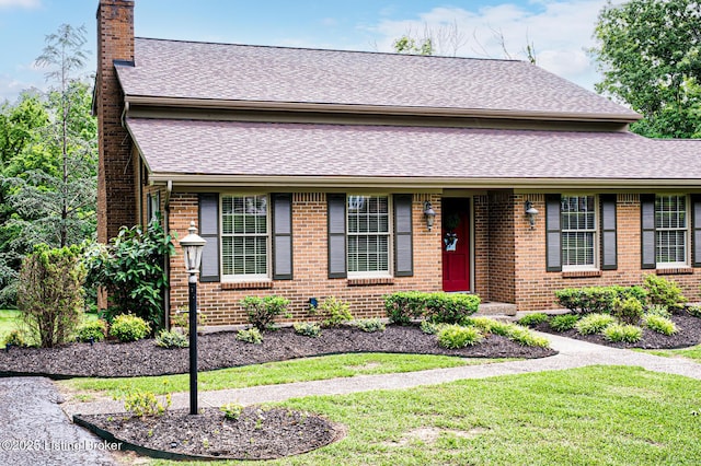 1014 Old Mill Stream Ln, Shepherdsville, KY 40165 - view of front of house with a chimney, brick siding, a shingled roof, and a front yard