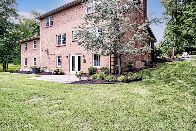 1014 Old Mill Stream Ln, Shepherdsville, KY 40165 - rear view of property with a lawn, brick siding, central air condition unit, and a patio