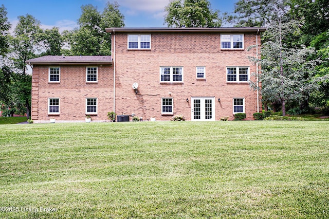 1014 Old Mill Stream Ln, Shepherdsville, KY 40165 - back of property featuring french doors, central air condition unit, a lawn, and brick siding