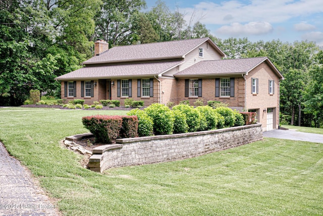 1014 Old Mill Stream Ln, Shepherdsville, KY 40165 - view of front of house with a chimney, driveway, a garage, brick siding, and a front lawn