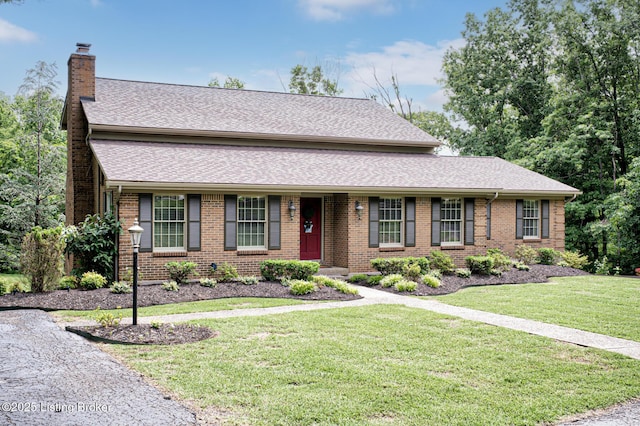 1014 Old Mill Stream Ln, Shepherdsville, KY 40165 - view of front of property with a chimney, brick siding, a front lawn, and a shingled roof
