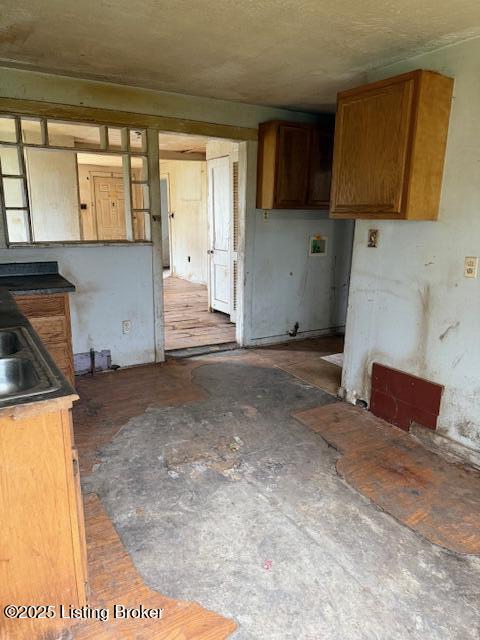 kitchen featuring a sink and brown cabinetry