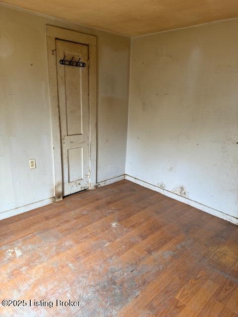 empty room with wood-type flooring