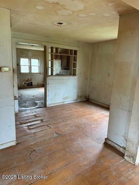 empty room featuring wood-type flooring