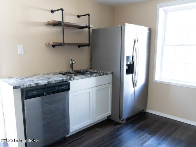 kitchen with dark wood-style flooring, white cabinets, appliances with stainless steel finishes, a sink, and open shelves
