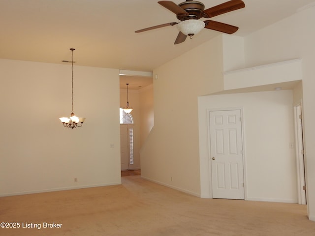 113 Lanai Dr Unit A, Shepherdsville, KY 40165 - carpeted empty room featuring a towering ceiling, ceiling fan with notable chandelier, and baseboards