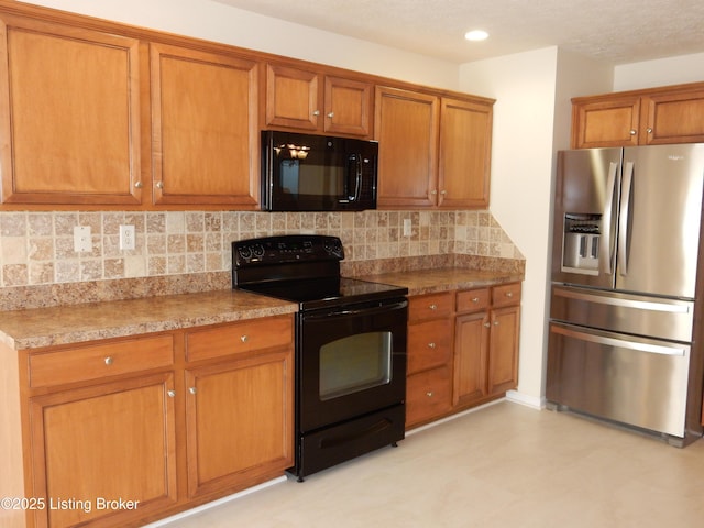 113 Lanai Dr Unit A, Shepherdsville, KY 40165 - kitchen featuring light countertops, brown cabinets, recessed lighting, black appliances, and backsplash