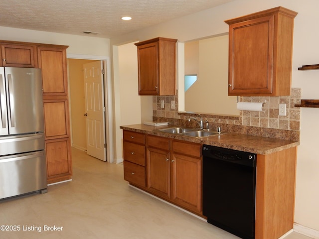 113 Lanai Dr Unit A, Shepherdsville, KY 40165 - kitchen with backsplash, a sink, freestanding refrigerator, black dishwasher, and brown cabinets