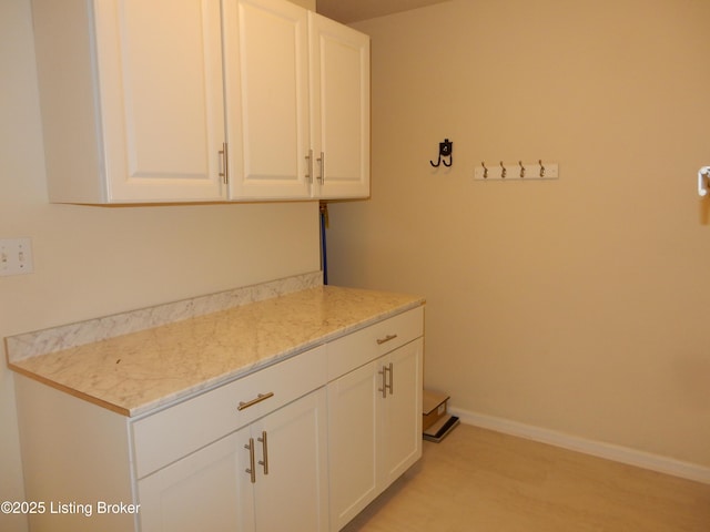 113 Lanai Dr Unit A, Shepherdsville, KY 40165 - laundry area featuring baseboards and light wood-style floors