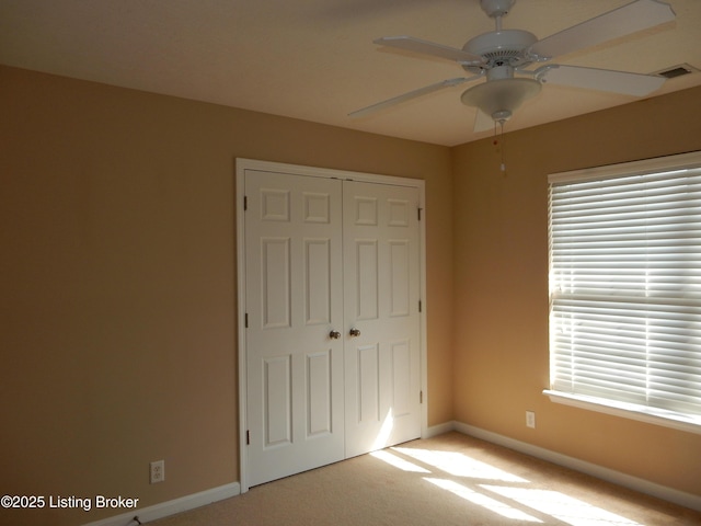 113 Lanai Dr Unit A, Shepherdsville, KY 40165 - unfurnished bedroom featuring a closet, baseboards, visible vents, and multiple windows