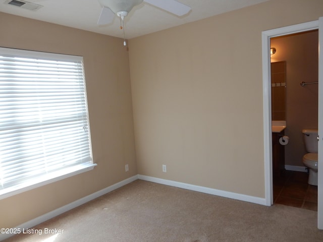 113 Lanai Dr Unit A, Shepherdsville, KY 40165 - unfurnished bedroom with a ceiling fan, ensuite bathroom, baseboards, light colored carpet, and visible vents