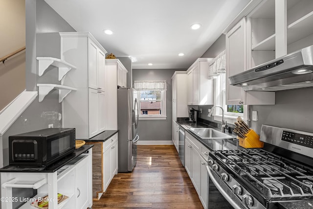 4613 S 2nd St, Louisville, KY 40214 - kitchen featuring a sink, open shelves, appliances with stainless steel finishes, under cabinet range hood, and dark countertops