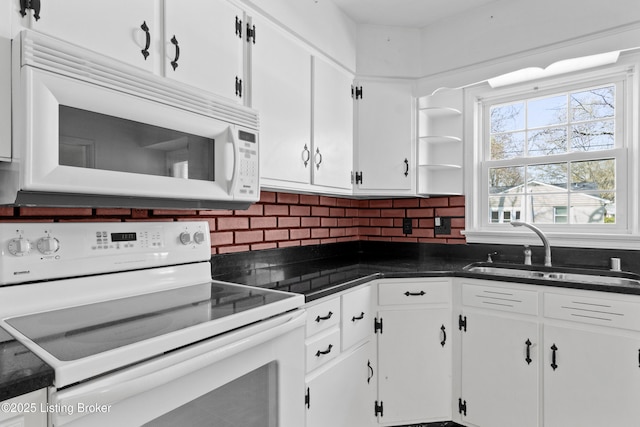 kitchen featuring a sink, decorative backsplash, white cabinetry, and white appliances