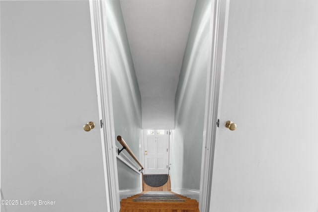 staircase featuring baseboards