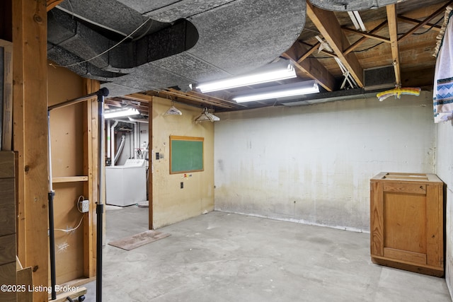 unfinished below grade area with washer / dryer