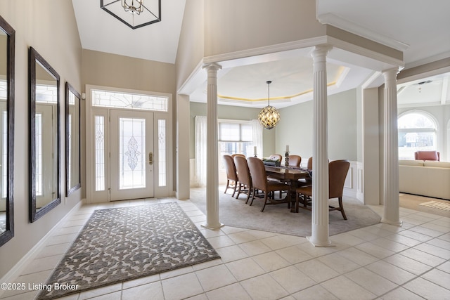 12206 Bridgeway Ct, Sellersburg, IN 47172 - foyer featuring light tile patterned flooring, a high ceiling, a chandelier, and decorative columns