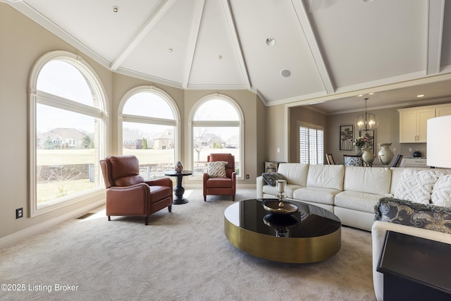 12206 Bridgeway Ct, Sellersburg, IN 47172 - carpeted living room featuring high vaulted ceiling, beam ceiling, baseboards, ornamental molding, and an inviting chandelier