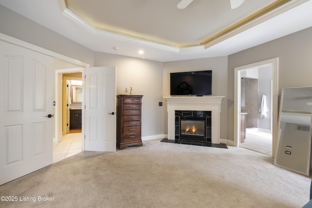12206 Bridgeway Ct, Sellersburg, IN 47172 - unfurnished living room featuring visible vents, a premium fireplace, ceiling fan, light carpet, and a tray ceiling